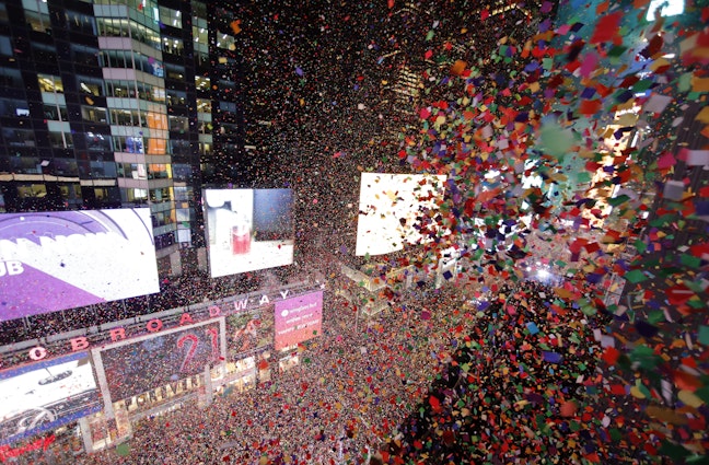 NEW YORK, NY - JANUARY 1: Confetti fills the air over top of revelers during New Year's Eve celebrations in Times Square on January 1, 2020 in New York City. (Photo by Gary Hershorn/Getty Images)